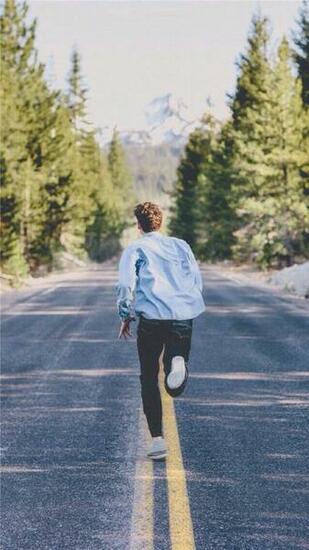 Handsome Young Man Running Street iPhone Wallpaper