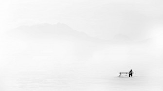 Minimalist Graphic Of Man Sitting Alone Wallpaper