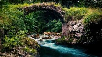 Stone Arch Over Mountain Stream Wallpaper