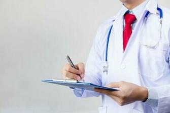 Medical Doctor Writing Prescription On White Isolated Background