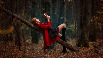 Girl Reading Book Lying On Back Outdoors Laptop Full HD 1080p Wallpaper