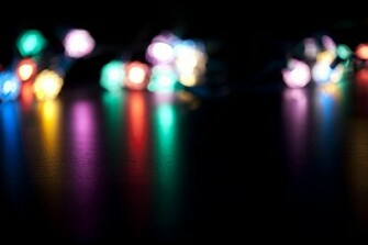 Blurred Colourful Festive Lights In The Distance Casting Long
