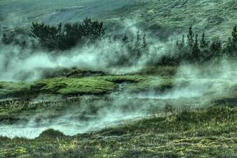 Steam Rising Above The Mossy Rocks Near Strokkur Geyserstrokkur