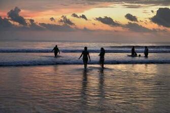 People Submerged In Sea Water During Sunset HD Wallpaper