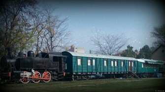 Train Wallpaper With Black Locomotive And Green Wagons