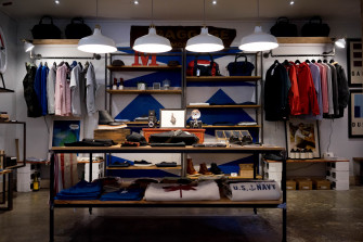 Racks With Mens Apparel On The Walls Of A Clothes Store Organization 4k HD Wallpaper