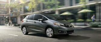 Honda Fit On Road In City Full Wide Side UHD Wallpaper