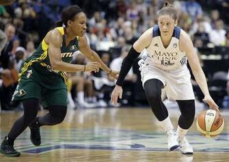 Minnesota Lynx Guard Lindsay Whalen Protects The Ball Against