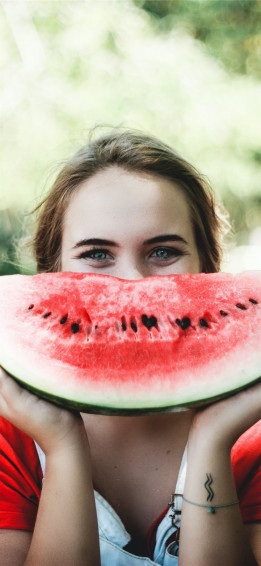 Woman Holding Sliced Watermelon iPhone Wallpaper