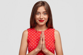 Timid Brunette Young Woman Posing Against White Wall Wallpaper