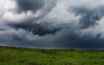 Storm Clouds Over The Field Wallpaper Nature