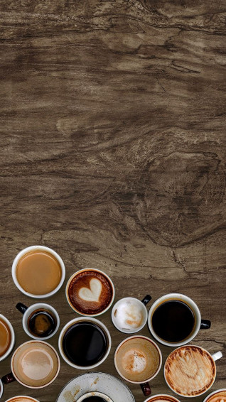 Assorted Coffee Cups On Natural Wooden Background Wallpaper