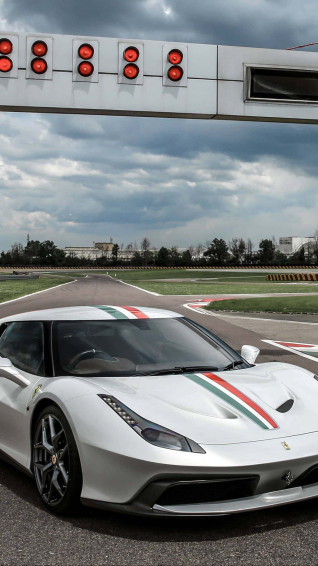 Speed Towards Your Goals With A White Ferrari iPhone Wallpaper