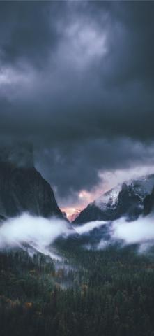 Brown Rocky Mountain Under Gray Sky iPhone Wallpaper