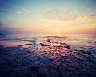 Calm Beach Rock Sunset Horizon Desktop Pc And Mac Wallpaper