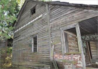 North Wall With Drop Siding And Porch Brick In