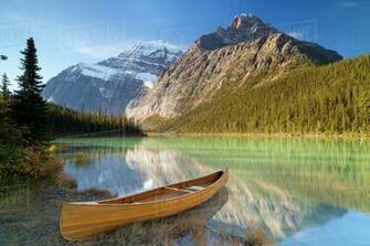 Canoe At Cavell Lake With Mount Edith In The Background