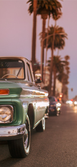 Vintage Car Parked On Ocean Blvd During Sunset