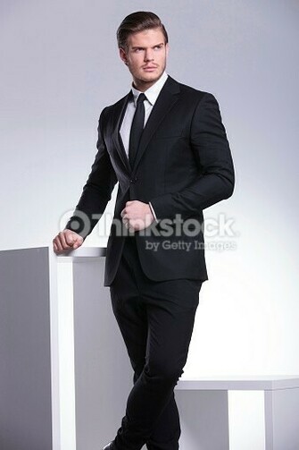 Stock Photo Handsome Business Man Leaning On A White Table
