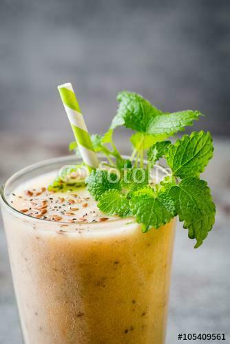 Banana And Lemon Smoothie On The Grey Background Stock Photo