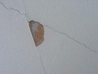 Through Gray Surface But Showing Seam Brown Paper On The Top Layer