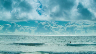 Man Swimming Alone In A Vast Ocean The Bermuda Triangle