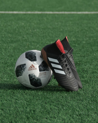 Black Adidas Cleats Lean On White And Soccer Ball