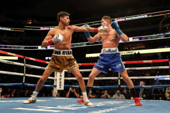 Two Boxers In Action A Boxing Ring Wallpaper