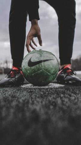 Football In Night iPhone Wallpaper