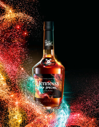 A Bottle Of Hennessy Bourbon With Colorful Swirls Wallpaper