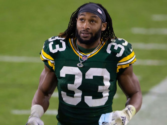 Aaron Jones Of The Green Bay Packers On Move Wallpaper