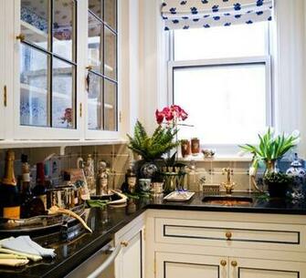 Countertops And Glass Front Upper Cabinets With Floral Wallpaper