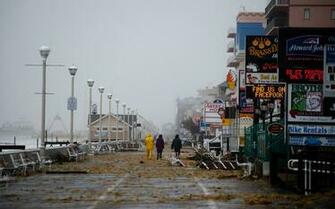 People Walk On The Boardwalk In Ocean City Maryland October