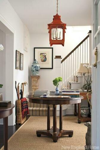 An Antique Table Anchors The Entry Bar Is