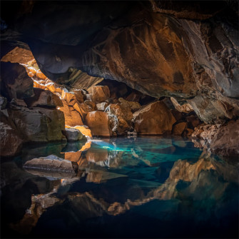 Iceland Cave Surrouned With Blue Body Of Water 5k iPad Pro