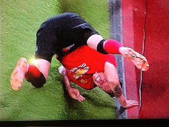 Phil Jones Crashing Out Of The Cup Wallpaper