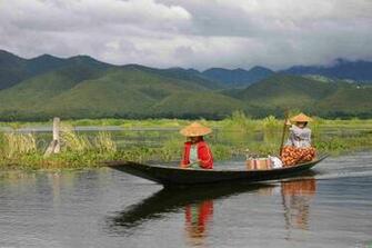 Two Women On A Boat Myanmar Wallpaper Open Walls