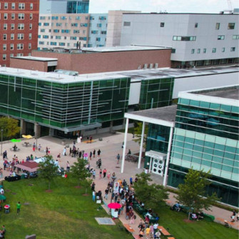 Students Navigating Through Wayne State University Campus Wallpaper