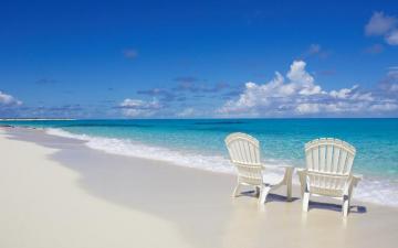 Beach Chairs On The Shore