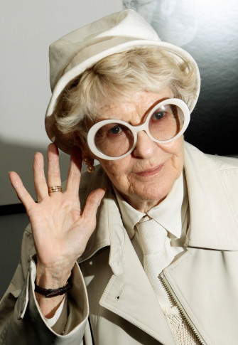 Actress Elaine Stritch Waving In All White Outfit Wallpaper