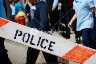 Police Barricade With Children In The Background Focus On