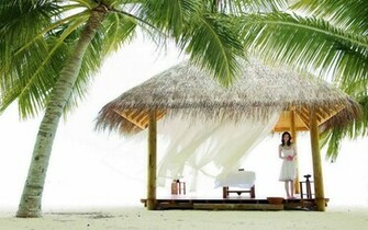 Woman In A Beach Hut Wallpaper