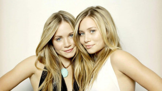 Identical Twins Women Smiling Together Wallpaper