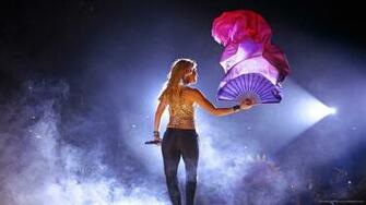 Shakira With A Hand Fan At Concert Wallpaper