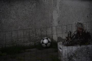 White And Black Ball Near Gray Fence Photo Grey Image On