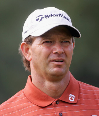 Retief Goosen Wearing A Taylormade White Hat During Golf Wallpaper