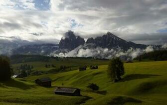 Misty Mountain Above A Tranquill Valley Wallpaper