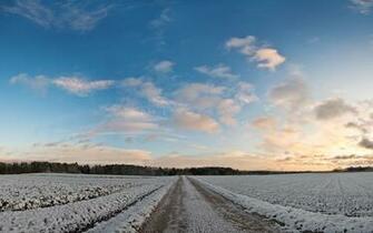 Road Throught He Snowy Field Wallpaper