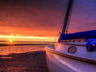 Beached Sailboat At Sunset High Quality And Resolution