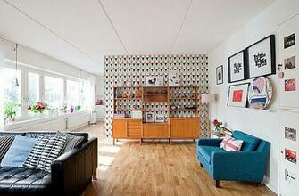 Modern Retro Living Room With A Bright Couch And Interesting Wallpaper